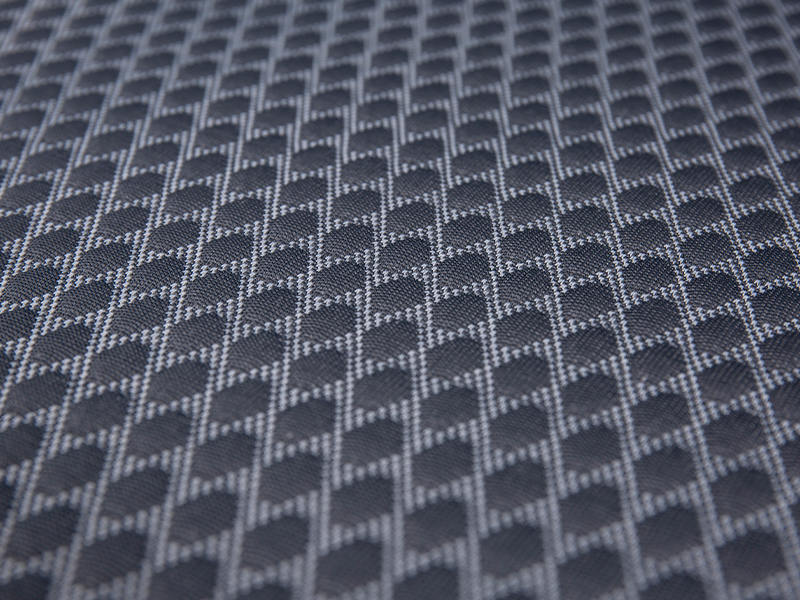 Neulottua jacquard-polyesteripatjan kangasta